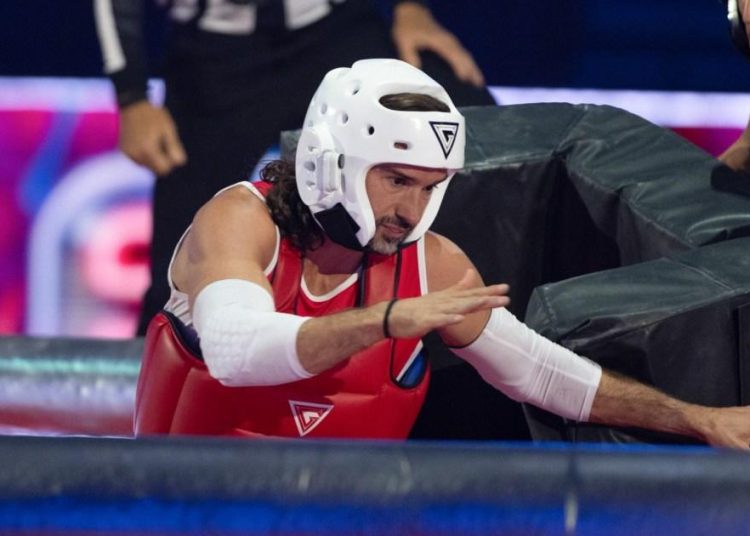 Gladiators star disqualified after giving Joe Wicks a ‘full whack to the head’